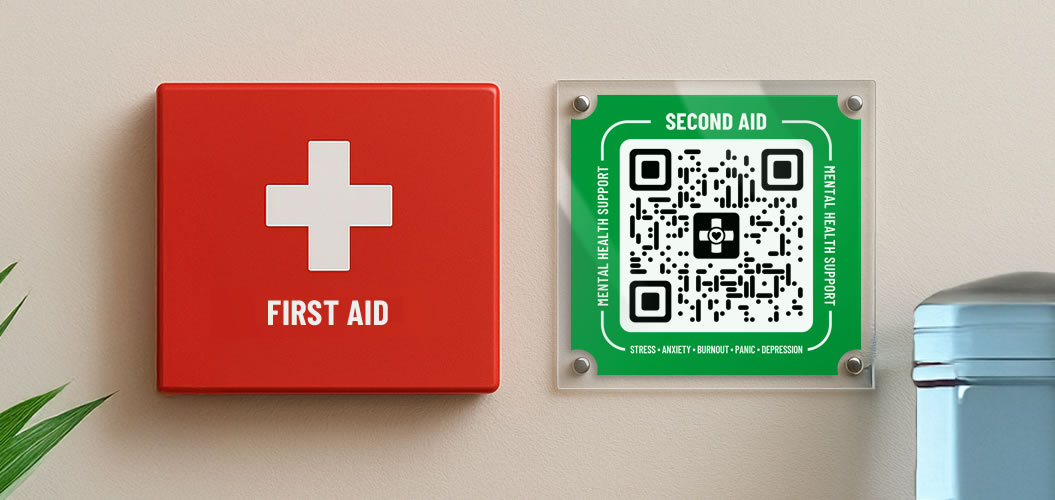 A first aid box next to a Second Aid mental health support sign